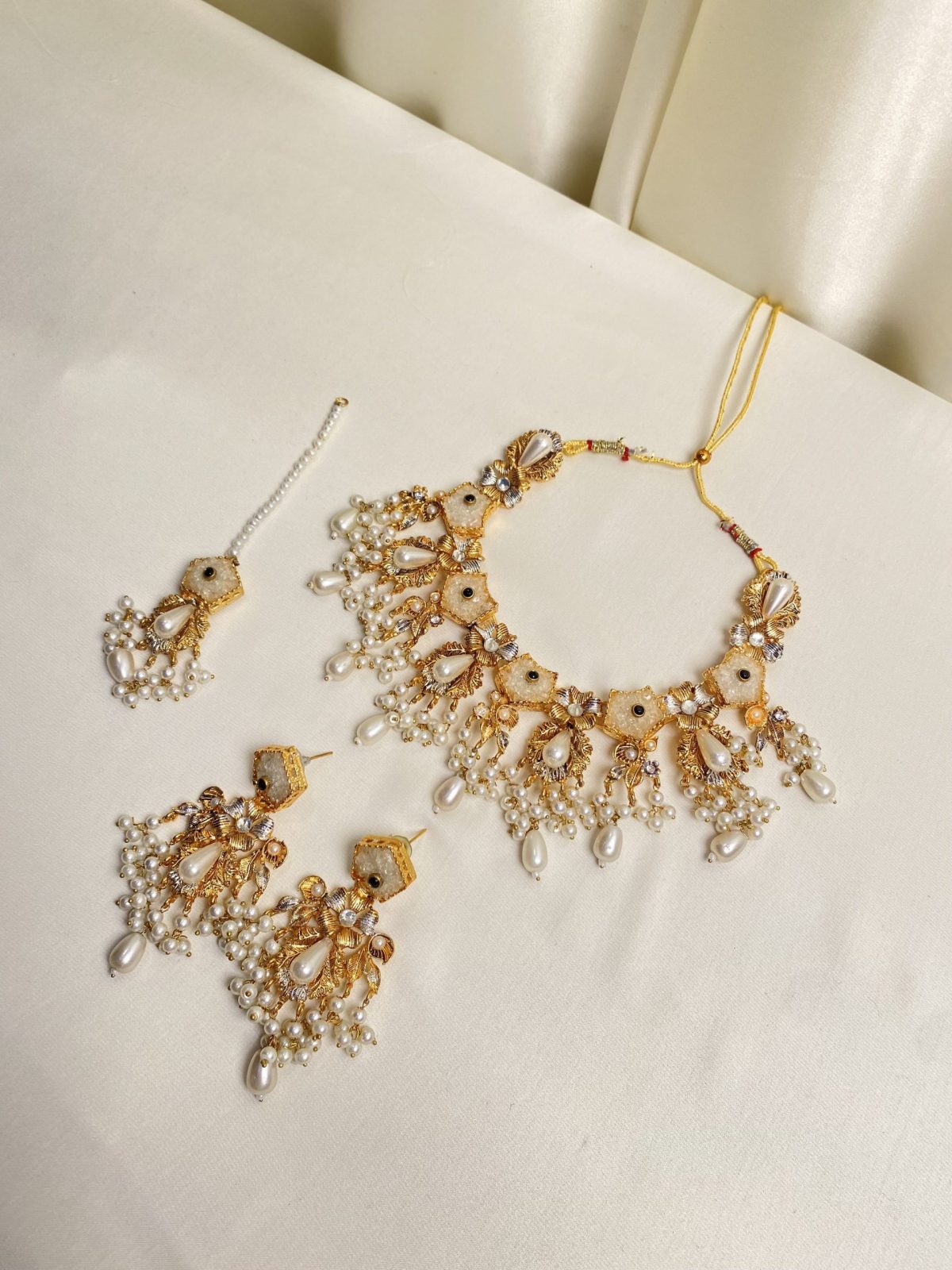 Luminous Elegance: A Sugar Stone Necklace Set in Ivory