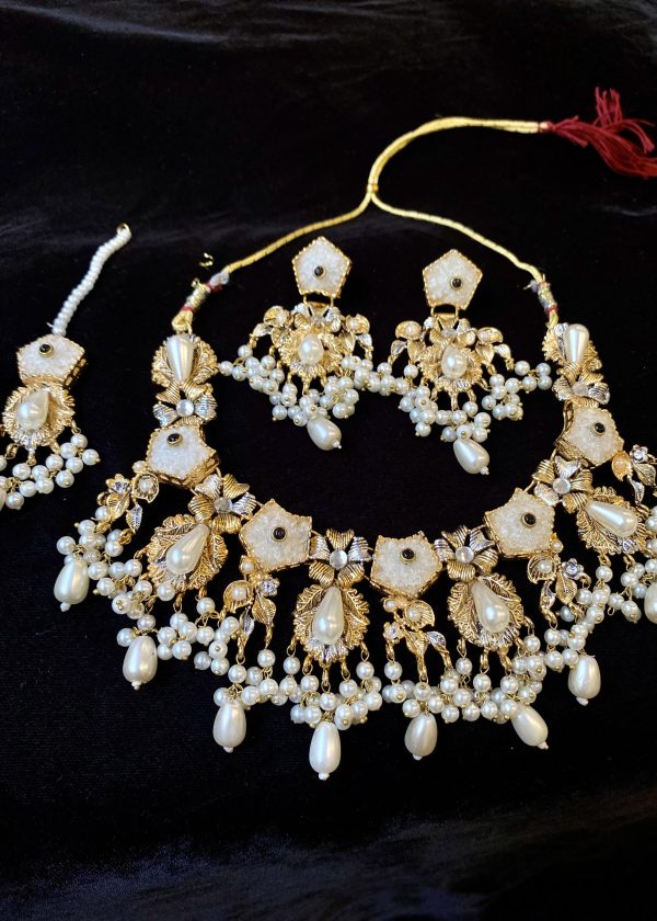 Luminous Elegance: A Sugar Stone Necklace Set in Ivory