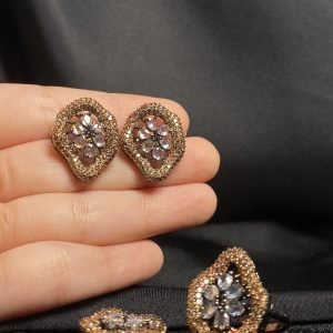Fushion Combo Set includes: Studs, Pendant and a Adjustable Ring. In beige color.