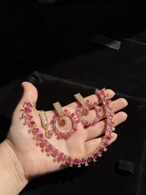 Rea Zircon Set in Ruby and gold.