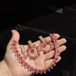 Rea Zircon Set in Ruby and gold.