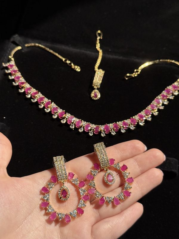 Rea Zircon Set in Ruby and gold.
