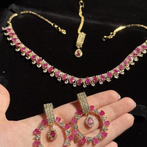 Rea Zircon Set in Ruby and gold.