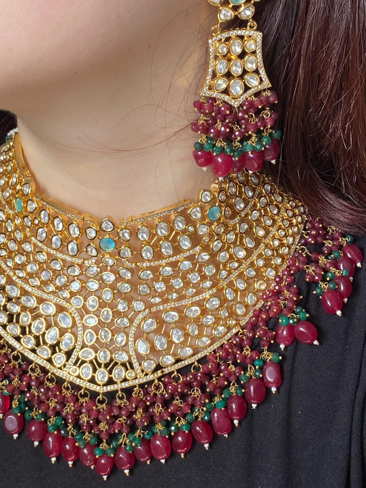 Mehrunisa Bridal Set with ruby and emerald bead accents.