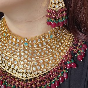 Mehrunisa Bridal Set with ruby and emerald bead accents.