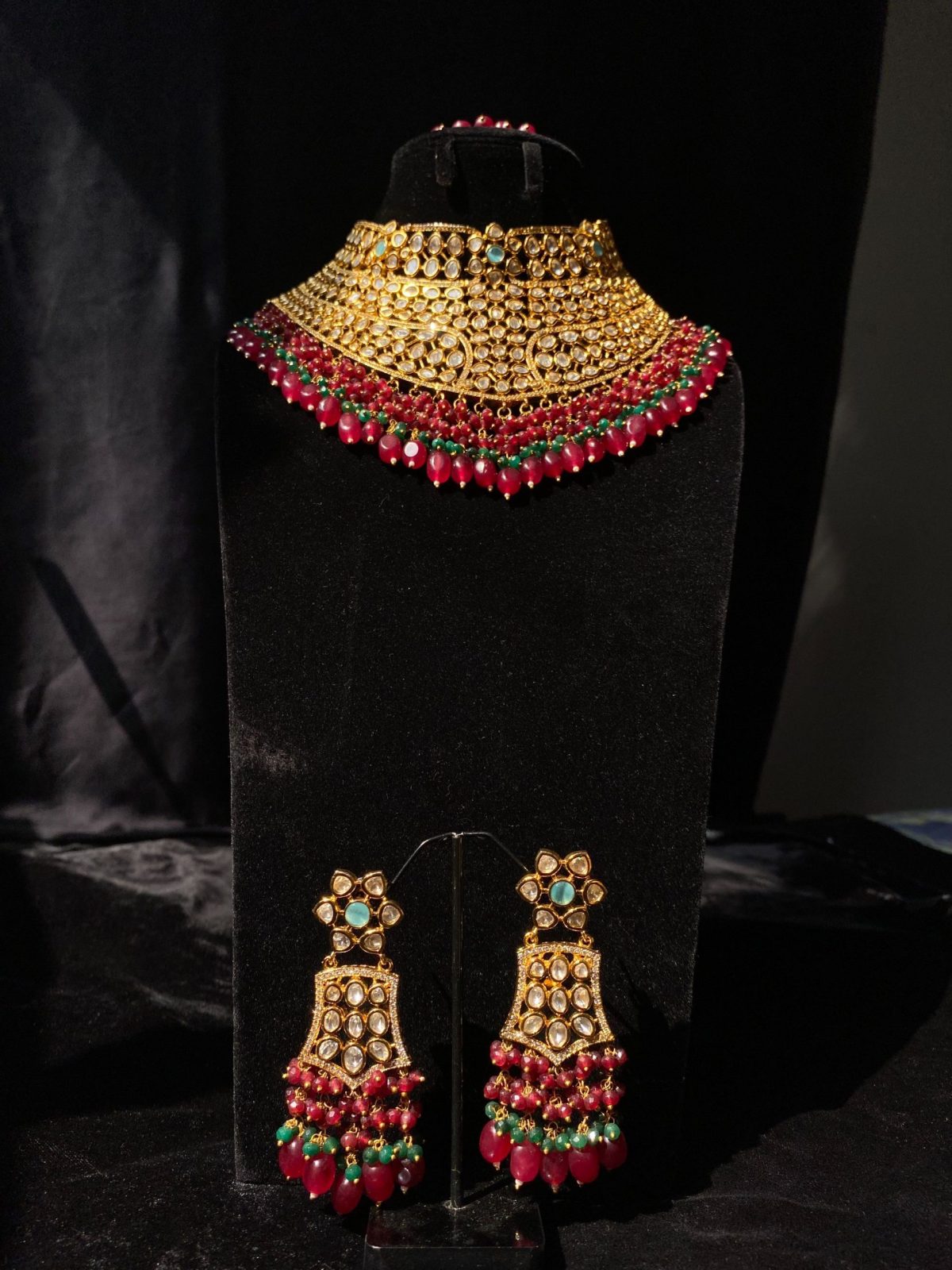 Mehrunisa Bridal Set with ruby and emerald bead accents.