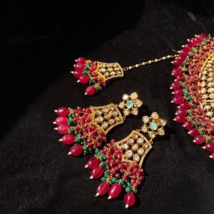 Mehrunisa Bridal Set with ruby and emerald bead accents.