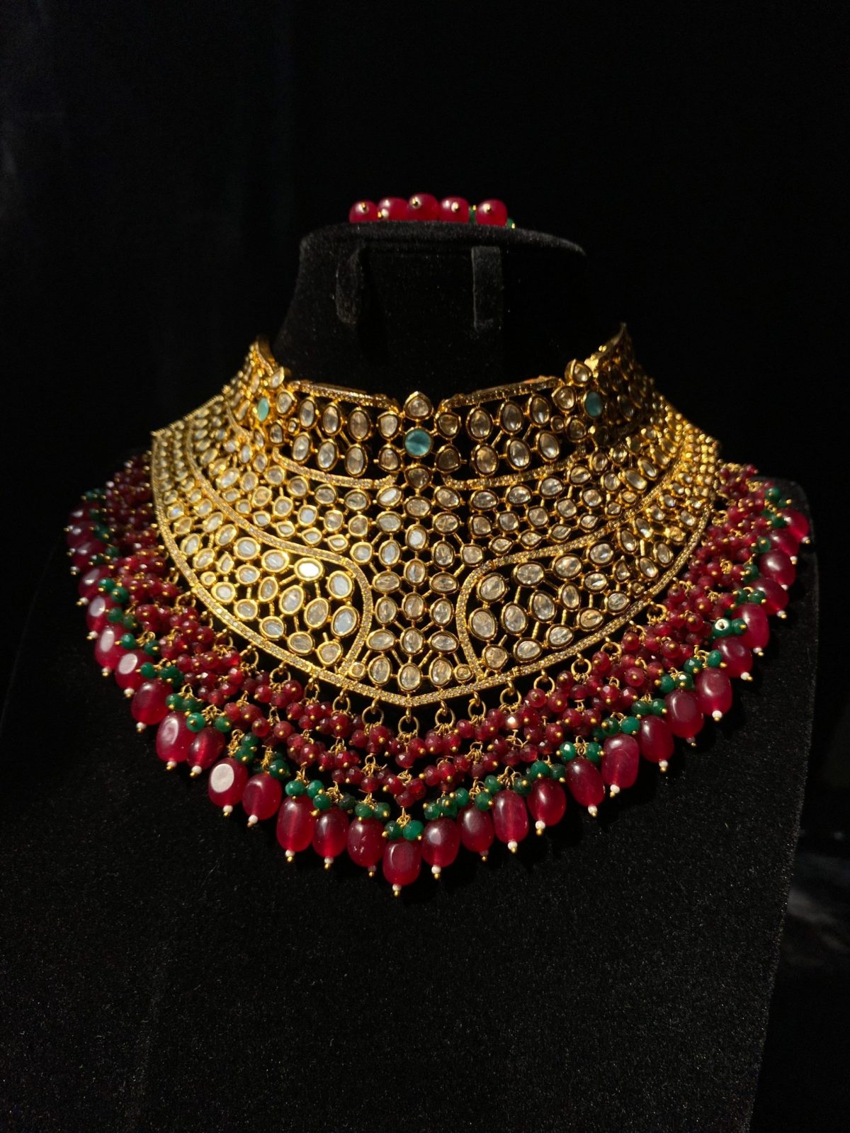 Mehrunisa Bridal Set with ruby and emerald bead accents.