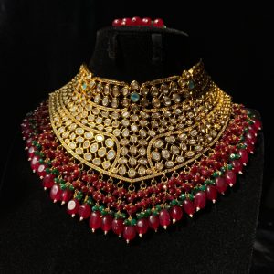 Mehrunisa Bridal Set with ruby and emerald bead accents.