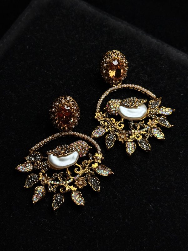 Ornate filigree birdcage drop earrings with a pearl and crystals in champagne