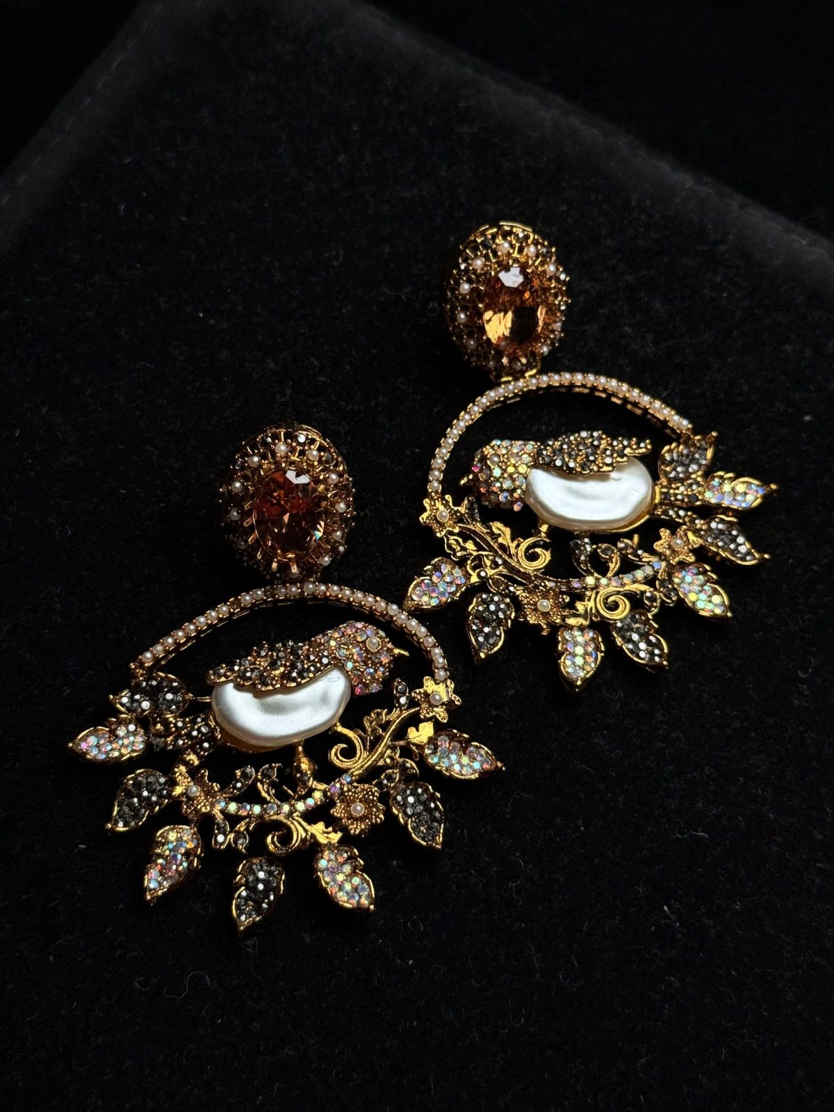 Ornate filigree birdcage drop earrings with a pearl and crystals in champagne