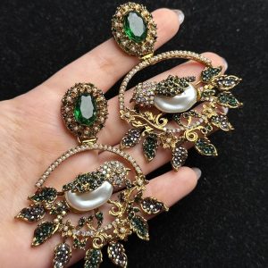 Ornate filigree birdcage drop earrings with a pearl and crystals in Green
