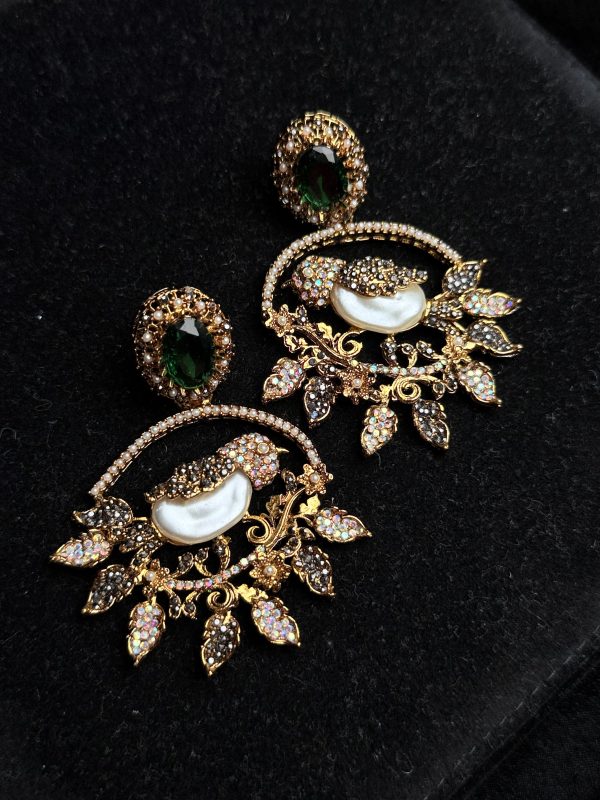 Ornate filigree birdcage drop earrings with a pearl and crystals in Green with black.