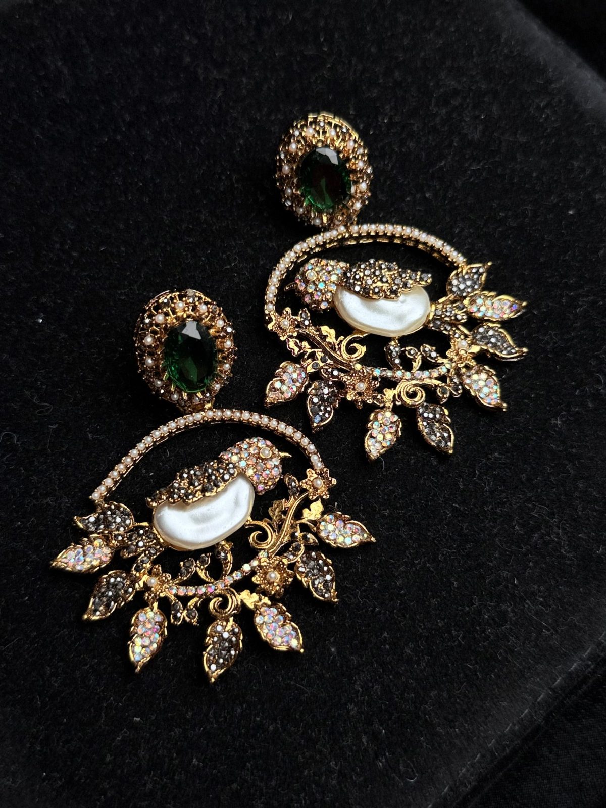 Ornate filigree birdcage drop earrings with a pearl and crystals in Green with black.