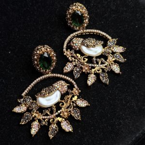 Ornate filigree birdcage drop earrings with a pearl and crystals in Green with black.