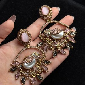 Ornate filigree birdcage drop earrings with a pearl and crystals in Pastel pink
