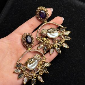 Ornate filigree birdcage drop earrings with a pearl and crystals in Purple