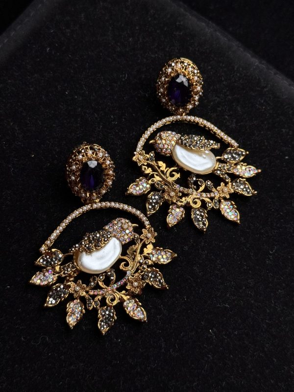 Ornate filigree birdcage drop earrings with a pearl and crystals in Purple
