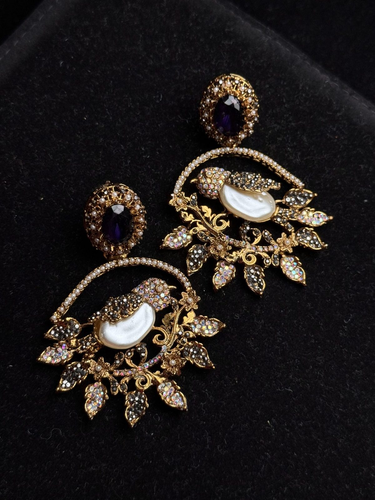 Ornate filigree birdcage drop earrings with a pearl and crystals in Purple