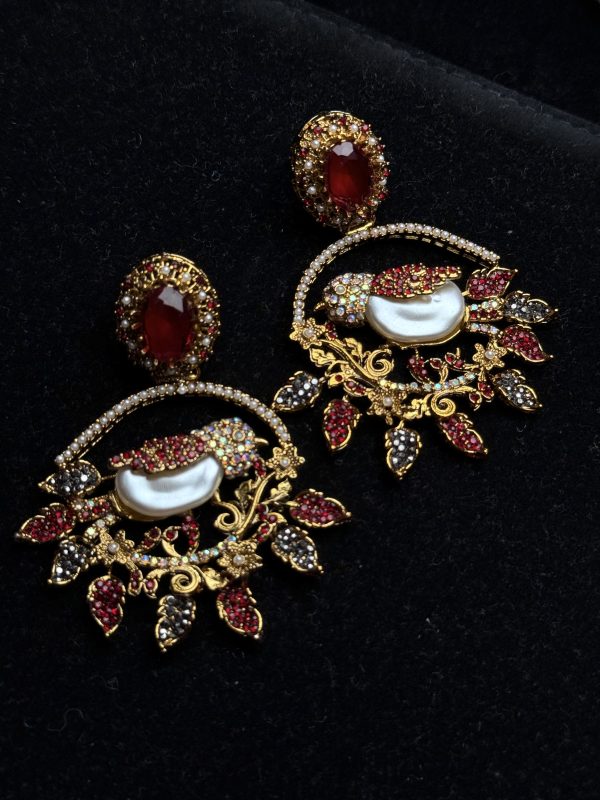 Ornate filigree birdcage drop earrings with a pearl and crystals in red