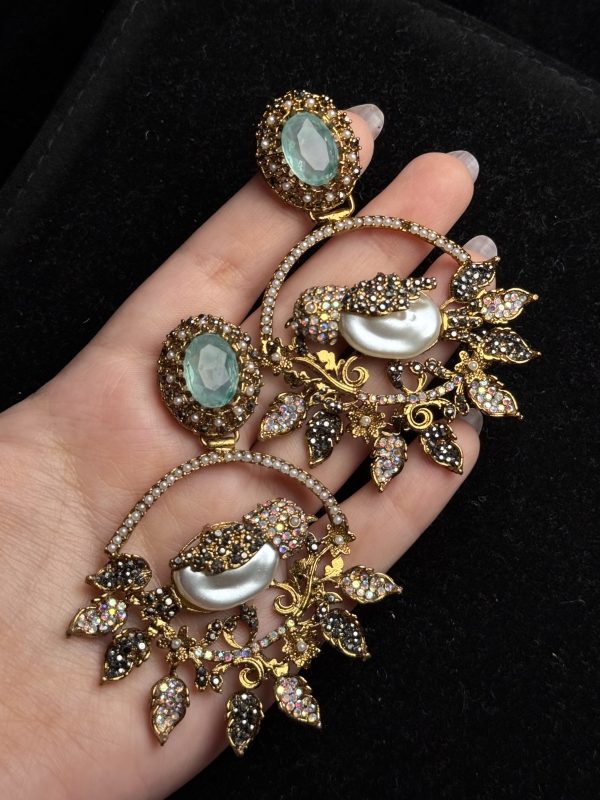Ornate filigree birdcage drop earrings with a pearl and crystals in Sea Green