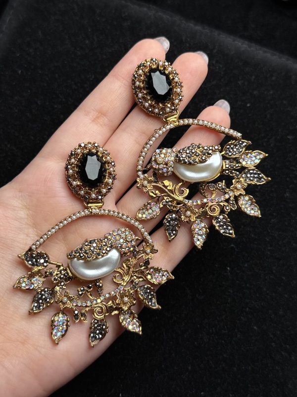 Ornate filigree birdcage drop earrings with a pearl and crystals in black