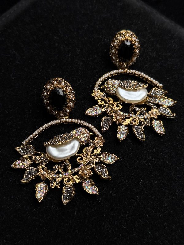 Ornate filigree birdcage drop earrings with a pearl and crystals in black