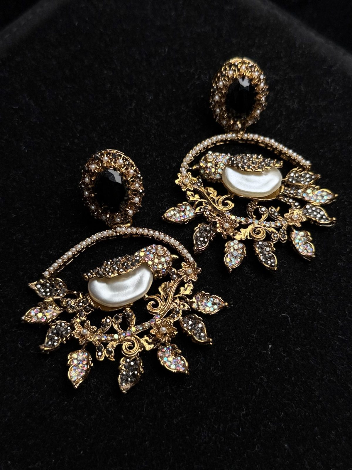 Ornate filigree birdcage drop earrings with a pearl and crystals in black