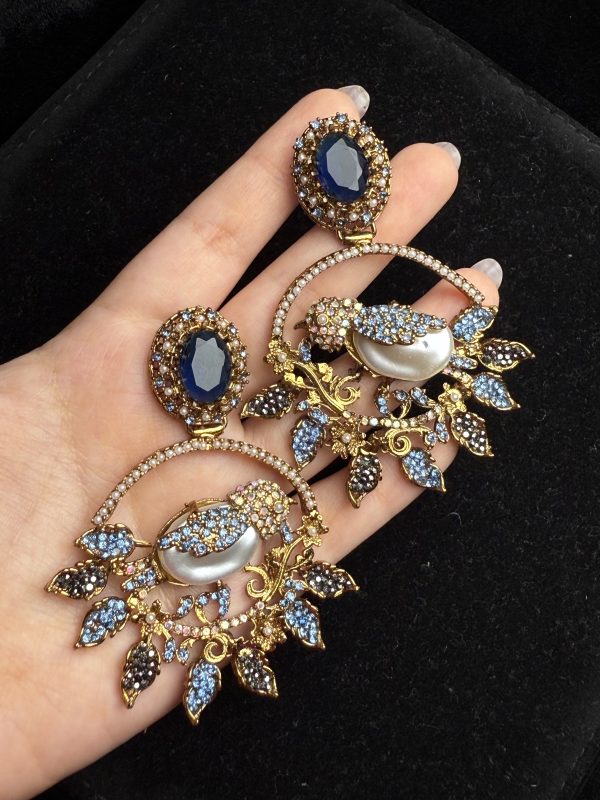 Ornate filigree birdcage drop earrings with a pearl and crystals in midnight blue