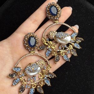 Ornate filigree birdcage drop earrings with a pearl and crystals in midnight blue