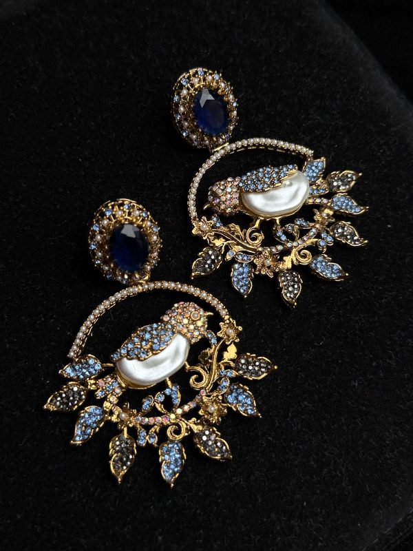 Ornate filigree birdcage drop earrings with a pearl and crystals in midnight blue