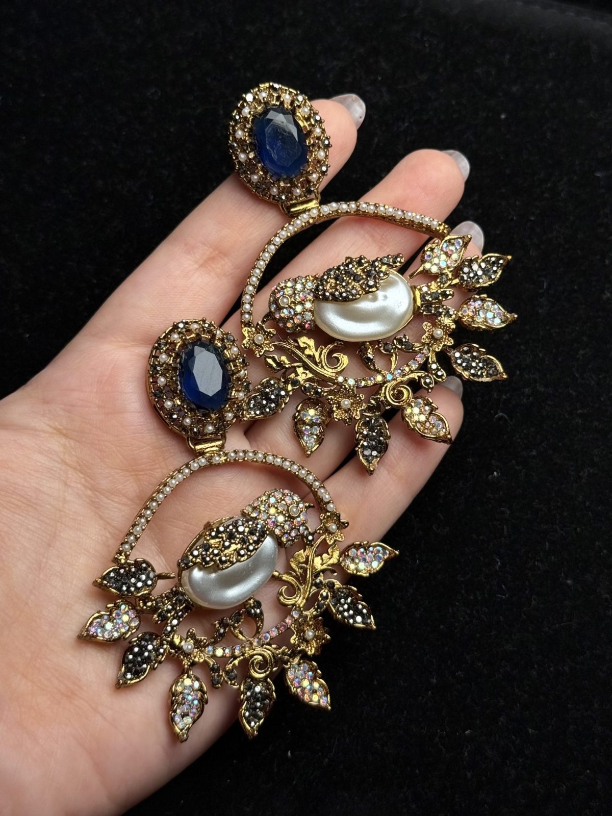 Ornate filigree birdcage drop earrings with a pearl and crystals in midnight blue with black