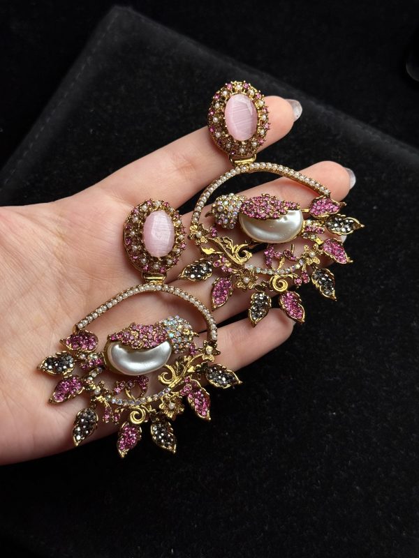 Ornate filigree birdcage drop earrings with a pearl and crystals in pink