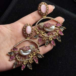Ornate filigree birdcage drop earrings with a pearl and crystals in pink