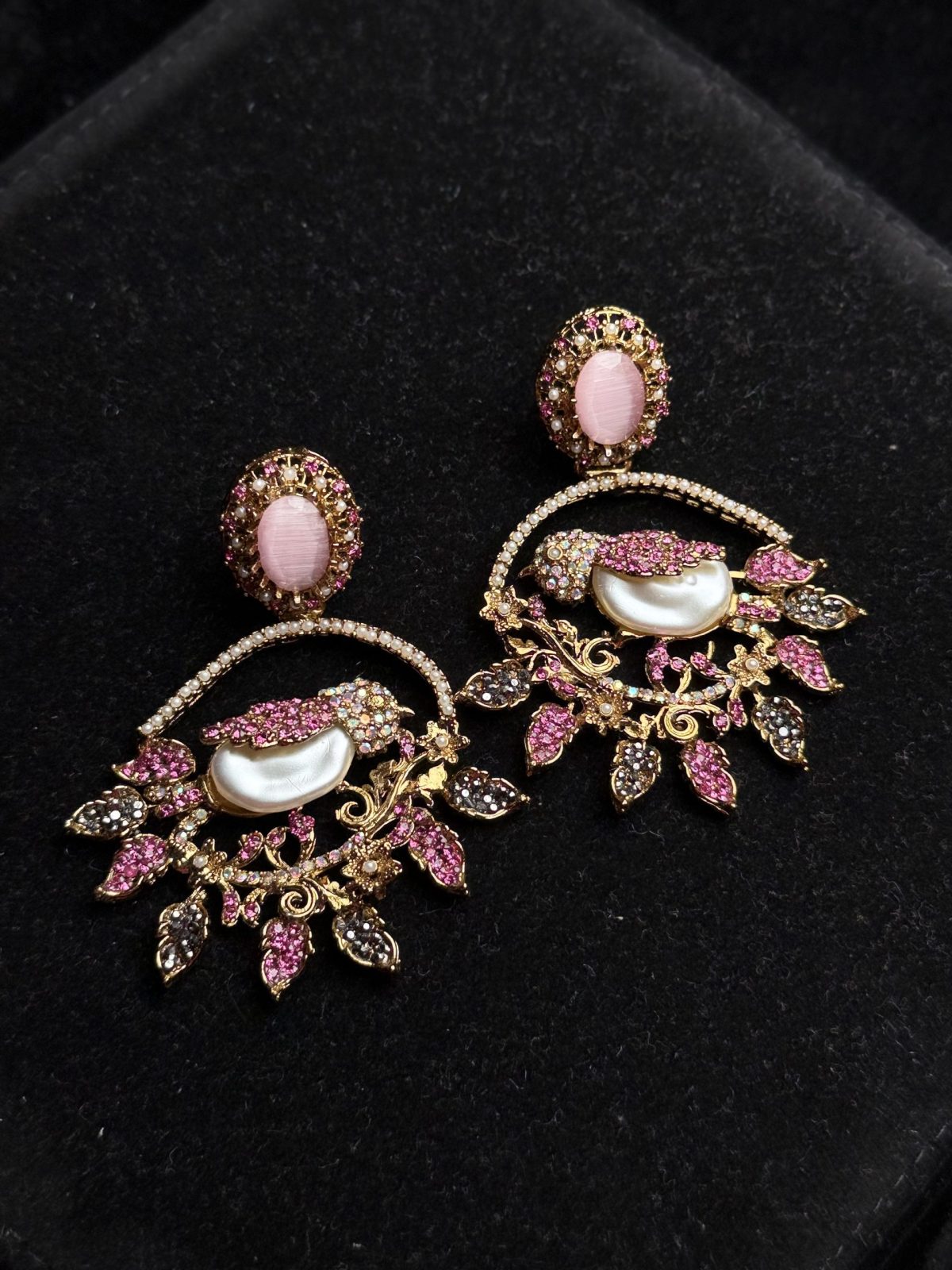 Ornate filigree birdcage drop earrings with a pearl and crystals in pink