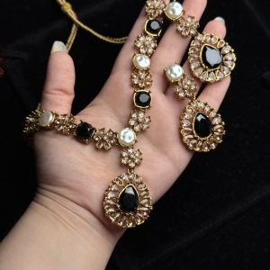 Whispering Blossom necklace and earrings set with pearls and petal-shaped gemstones in Black
