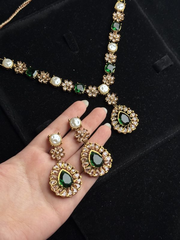 Whispering Blossom necklace and earrings set with pearls and petal-shaped gemstones in Green