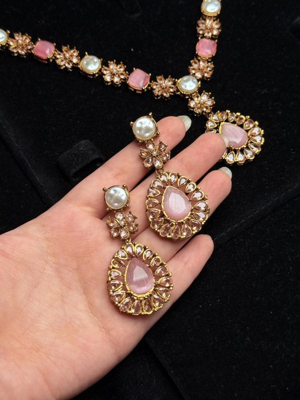Whispering Blossom necklace and earrings set with pearls and petal-shaped gemstones in Pink