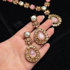 Whispering Blossom necklace and earrings set with pearls and petal-shaped gemstones in Pink