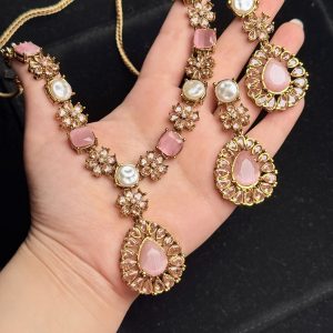 Whispering Blossom necklace and earrings set with pearls and petal-shaped gemstones in Pink