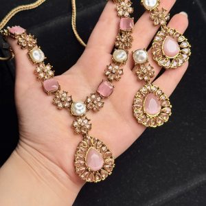 Whispering Blossom necklace and earrings set with pearls and petal-shaped gemstones in Pink