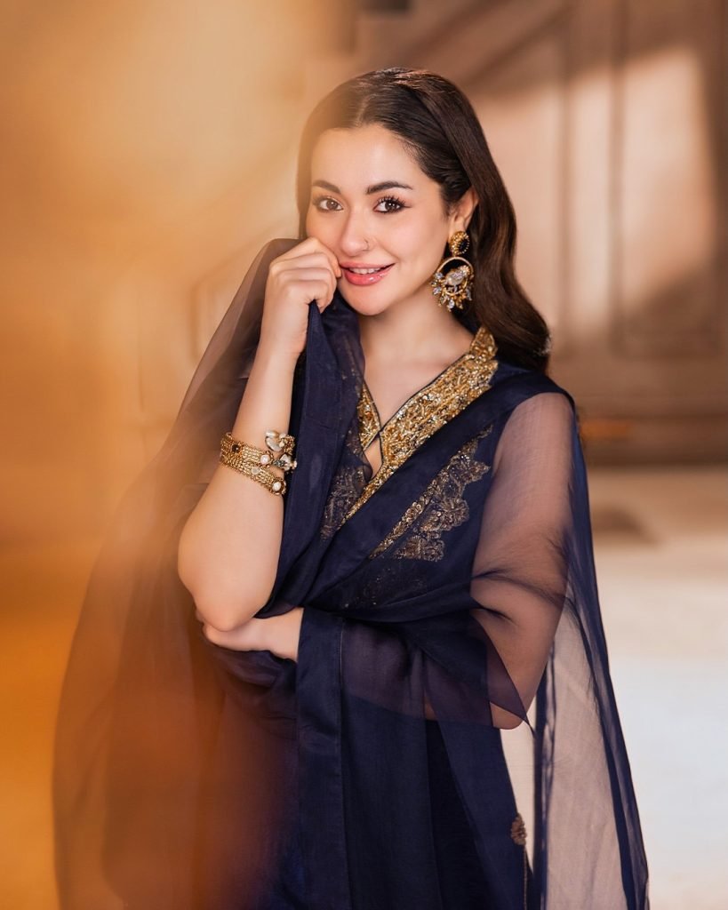 Hania Aamir Wearing Birdcage filigree earring in blue and gold by jewelist.pk