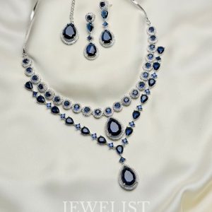 Twilight Brilliance Set by Jewelist.pk – two-layer sapphire blue necklace with teardrop gemstones and matching earrings, silver rhodium finish, Pakistani jewellery.