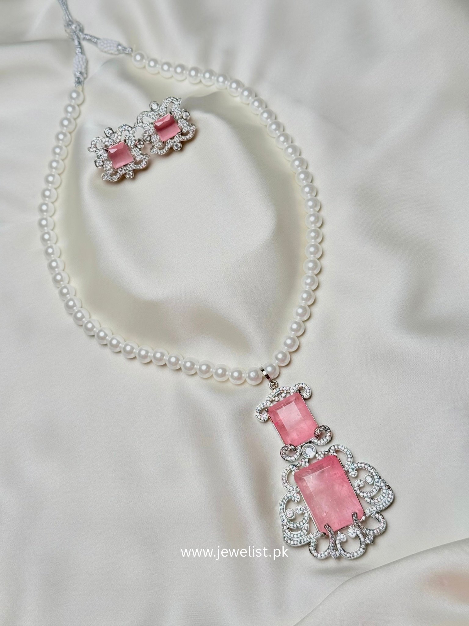 Doublet Pearl Mala Set by Jewelist in pink with pearl-like beads and matching earrings