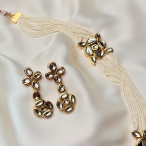 Aarya Kundan Set close-up with pearl strands and reflective kundan drop earrings