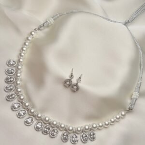 Isla Pearl Set close-up of pearl-like beads and oval halo drops