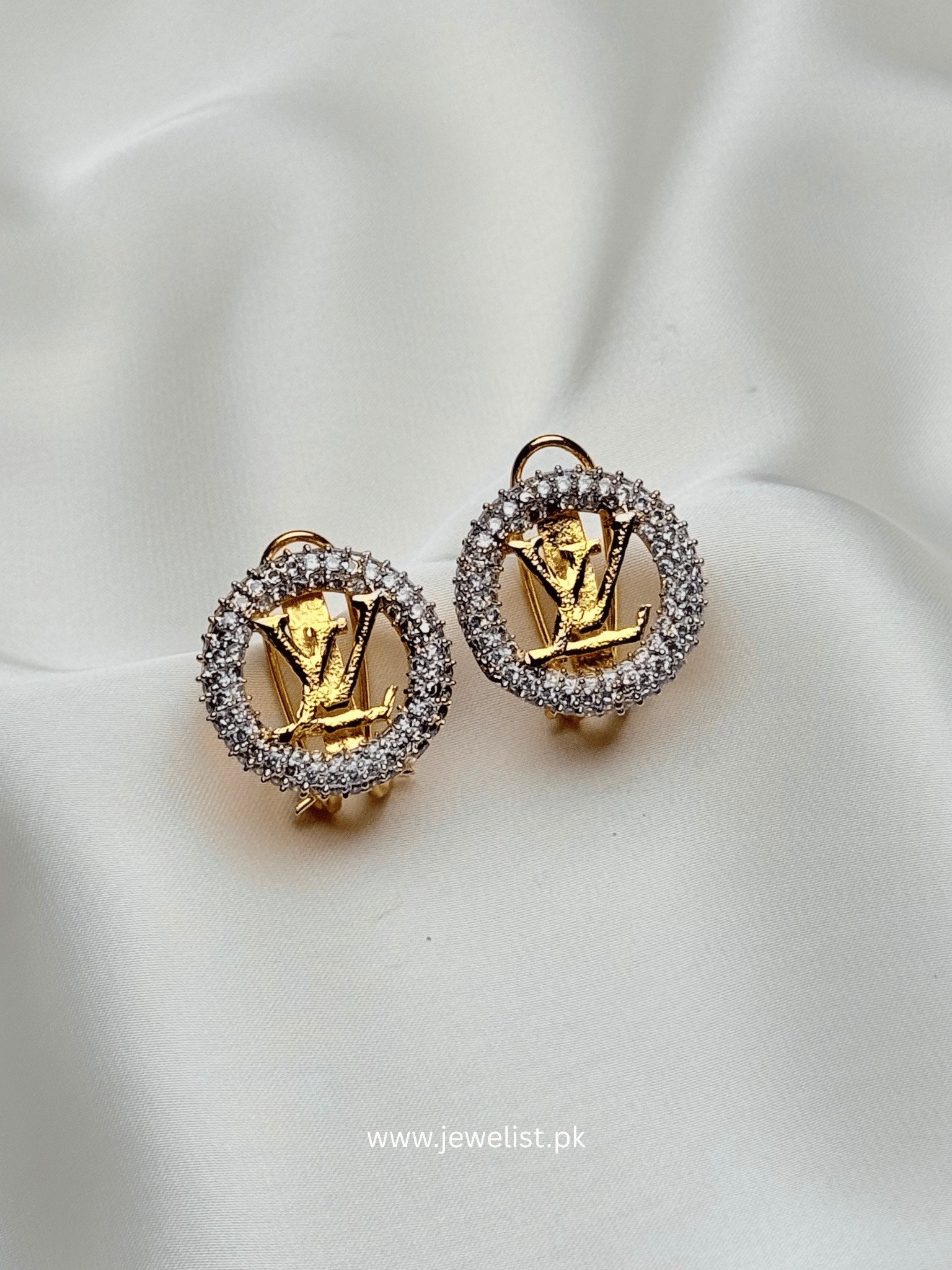 Zircon Logo Stud Earrings by Jewelist with gold-tone centerpiece and crystal halo