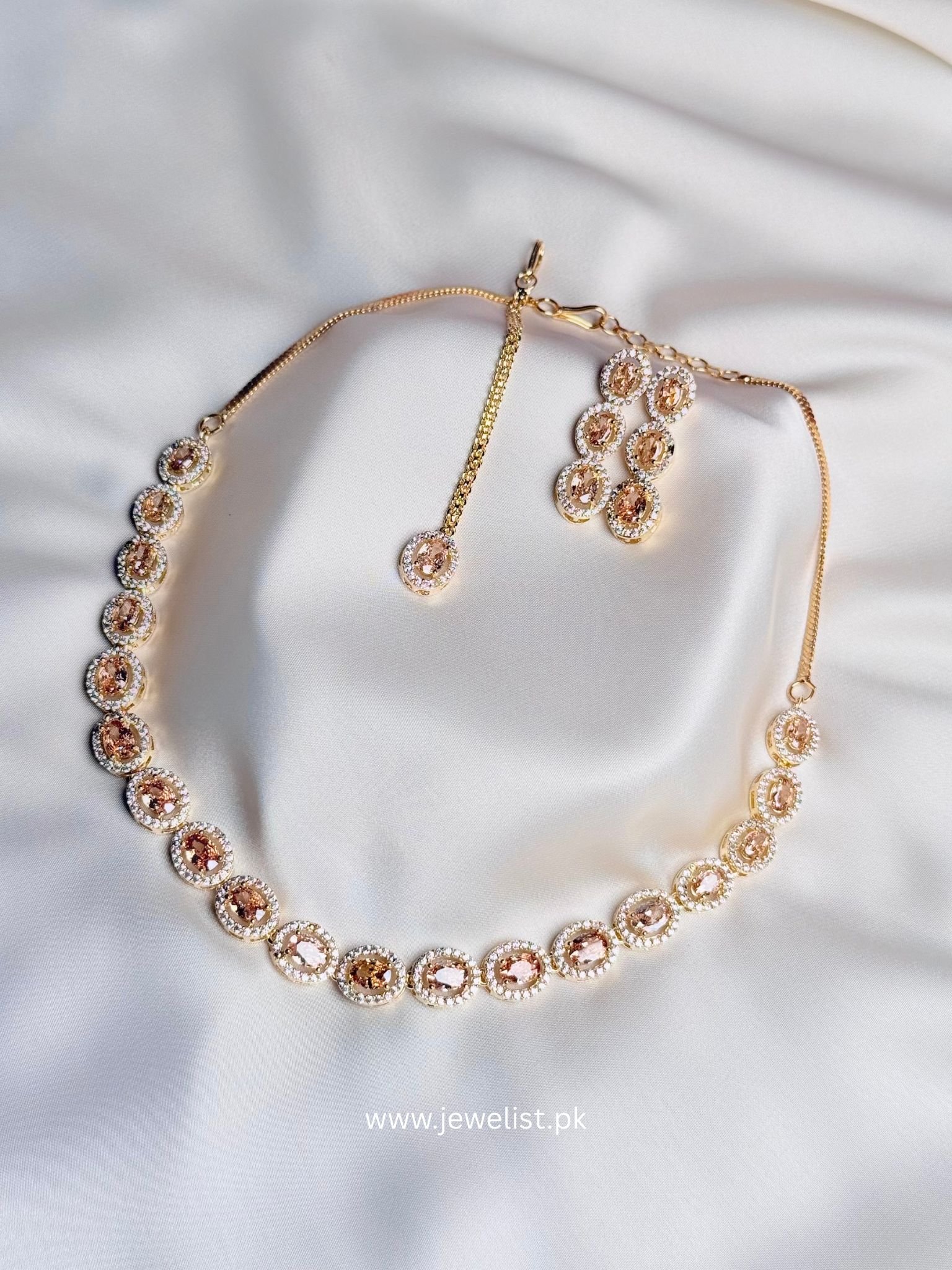 Elise Oval Solitaire Set in champagne with oval crystal-inspired necklace and matching pieces