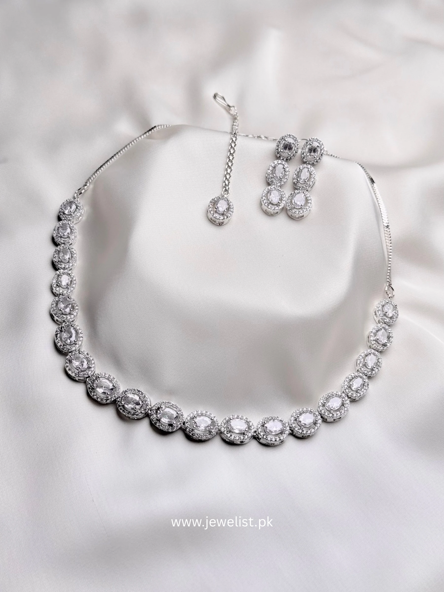 Elise Oval Solitaire Set in silver with oval crystal-inspired necklace, matching earrings and forehead ornament