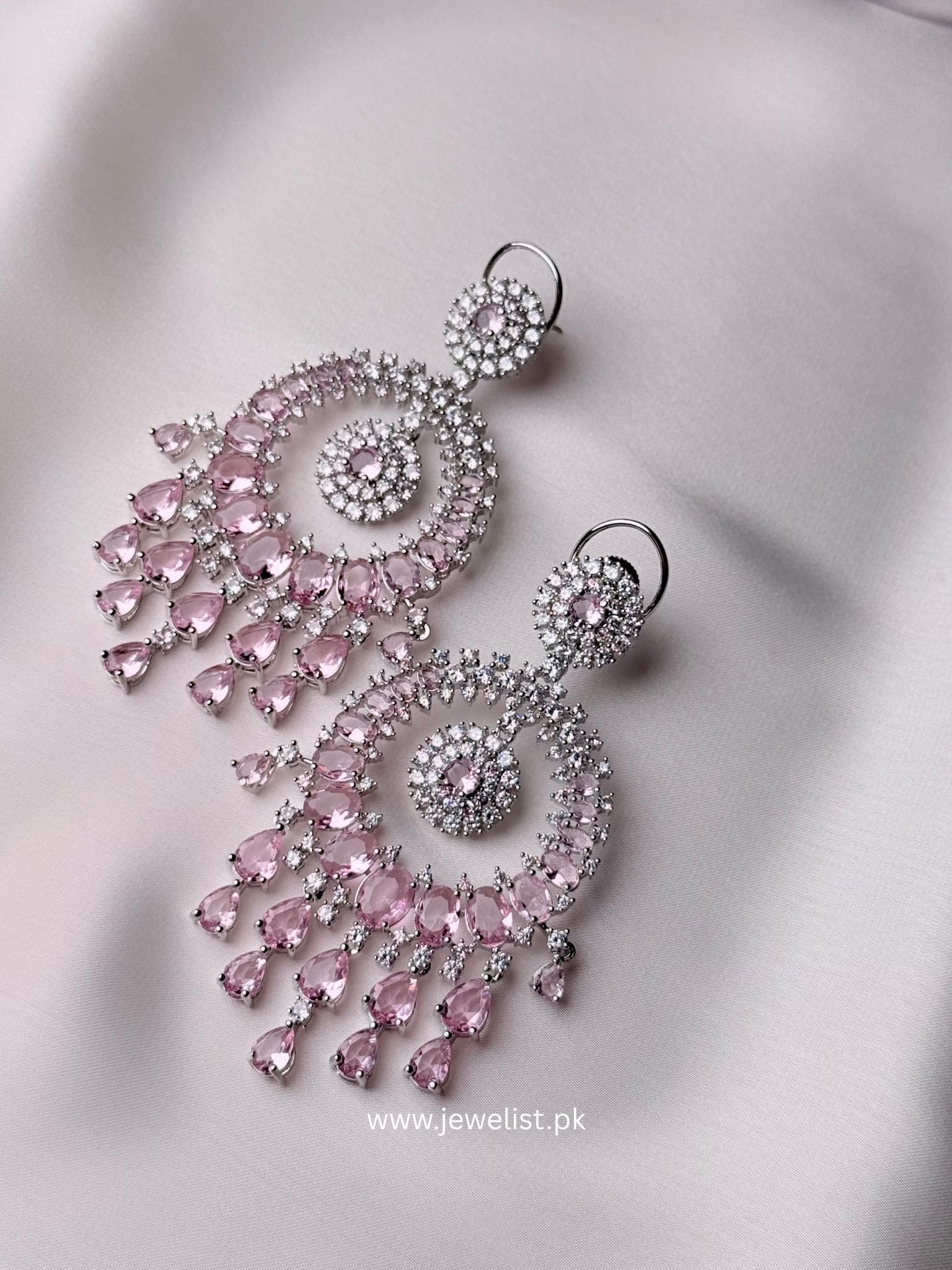 Celeste Cascade Earrings in blush pink with teardrop stones